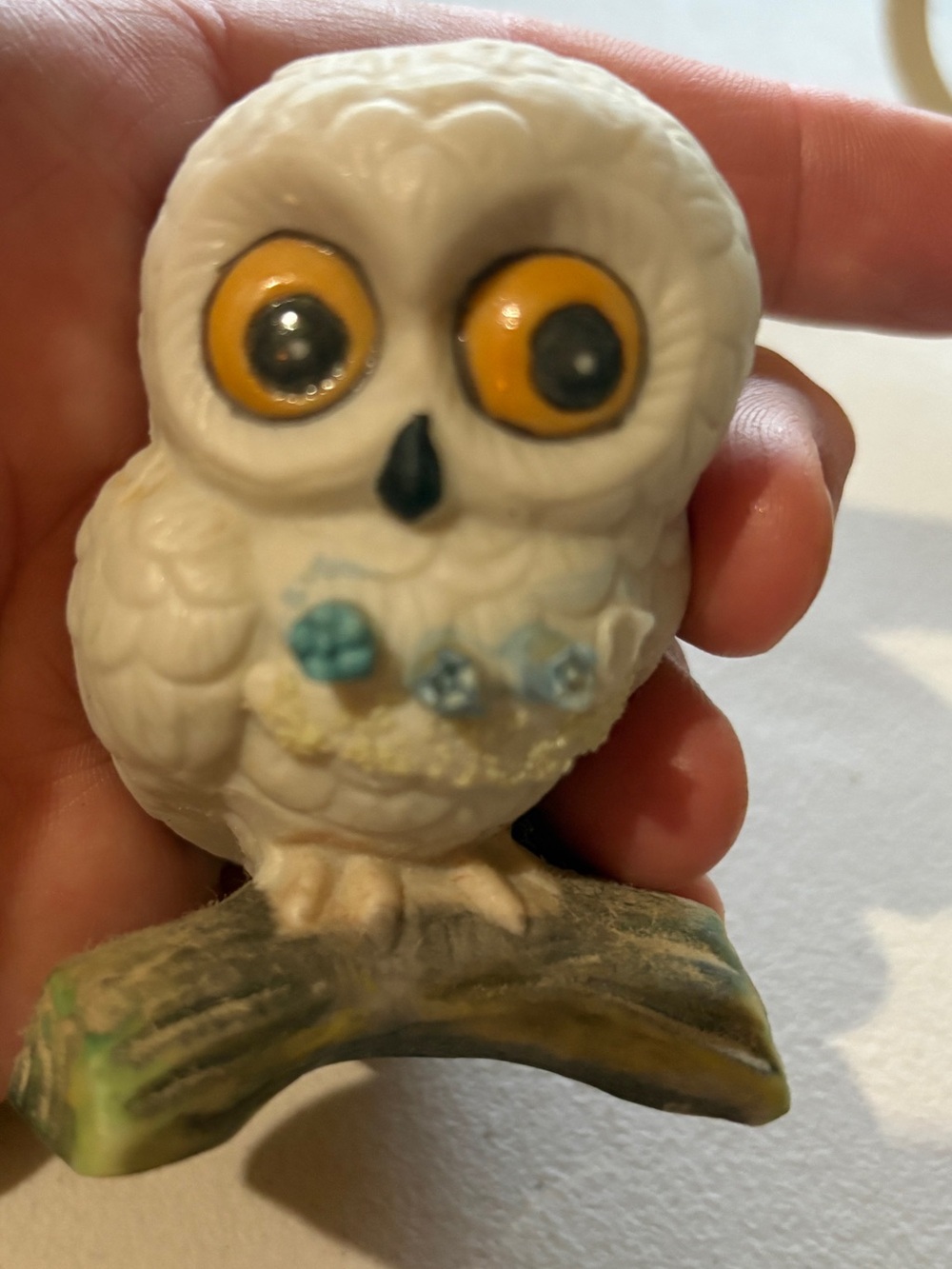White Ceramic Owl Figurine with Yellow Eyes and Blue Chest Accents